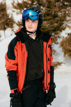 Young male skier ready for winter mountain fun