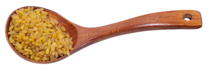 Isolated wooden spoon with raw bulgur on a white background