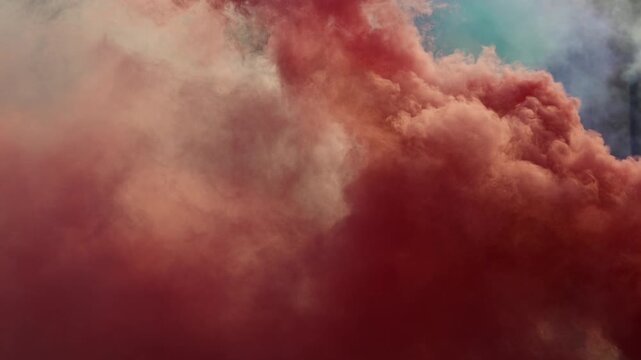 Thick colorful smoke cloud rising from bengal torch, abstract textured background with dramatic atmosphere, 4K slow motion at 120 fps