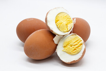 a boiled egg is cut in half, showing the texture of the white and yolk against the background of...