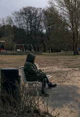 A woman at the park. Vertical photograph