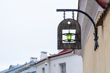 Decorative lantern with green light on the street