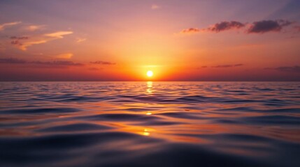 Vibrant sunset over the ocean with colorful clouds and rippling water