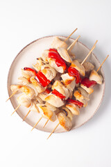 Grilled chicken skewers. Satay with side lemon and salad. Kebab with sauces. 