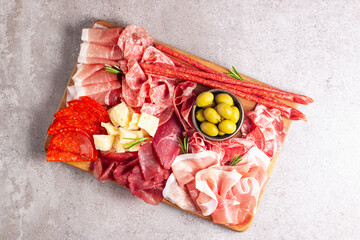 Charcuterie board. Antipasti appetizers of meat and cheese platter with salami, prosciutto crudo or jamon and olives