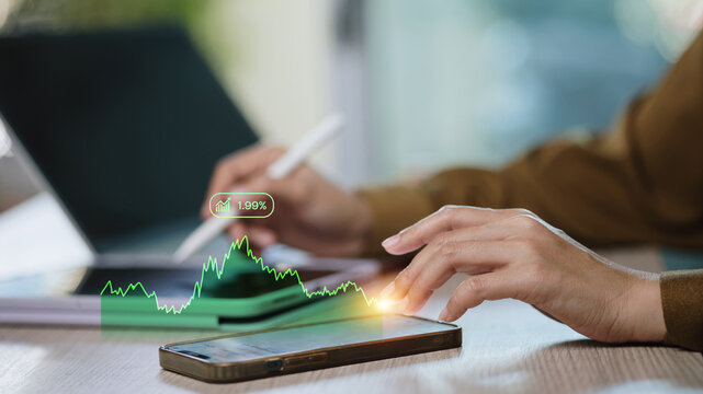 Mobile stock trading app with green market chart growth on smartphone, fintech investing concept