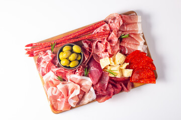Charcuterie board. Antipasti appetizers of meat and cheese platter with salami, prosciutto crudo or jamon and olives