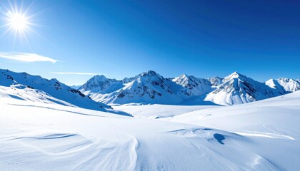 Obraz premium Majestic snow-covered mountains under a bright sun, showcasing a serene winter landscape