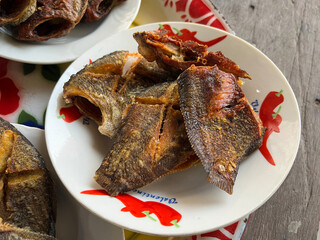 fried Gourami fish on a plate