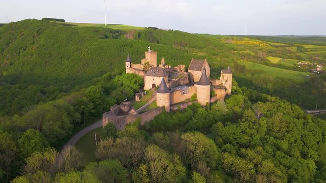 bourscheid castle ch&acirc;teau de green cover hills farms river valley beautiful homes entry gate entire compound visible to left around right circles drone luxembourg 