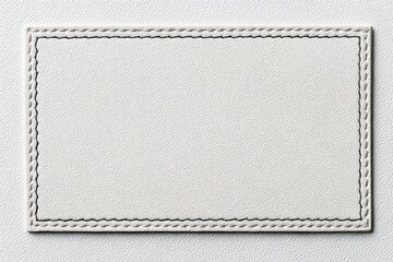 Blank White Rectangular Label with Stitched Border Edges for Text Space. Pristine fabric clothing label with tightly woven textile texture. Leather Jeans label mockup. Clear adherent tag. Empty oblong