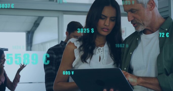 Collaborating professionals analyzing digital currency on laptop at modern office, with glass walls