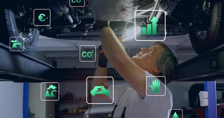 Drilling mechanic using power drill under vehicle chassis on lift in workshop, with overlay icons