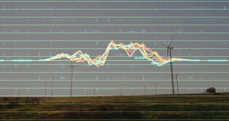 Looming wind turbine rising over grassy plain, with grid, line graph, numeric labels, copy space