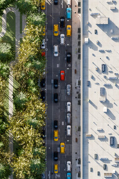 Aerial 3d city street with traffic, cars, building and green park