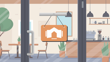 View through a glass door of a cozy cafe interior, showing tables and chairs, a hanging sign with a house icon, a coffee machine, and shelves with mugs, suggesting a welcoming atmosphere for