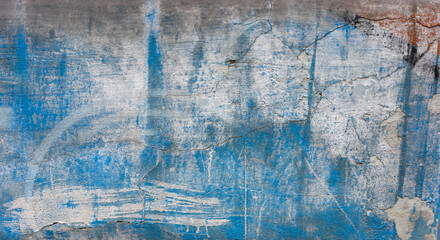 Weathered blue and gray wall texture with cracks and imperfections