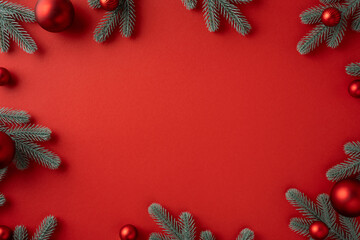 Layout with a vivid red backdrop framed by frosted pine branches and red ornaments, perfect for...