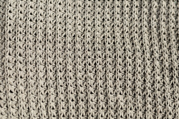 Knitted grey wool texture close-up