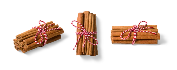 Fototapete Zu Essen Three bundles of cinnamon sticks tied with red and white twine isolated on a transparent background, PNG. High resolution. Natural Aromatic Spice for Cooking and Baking  © PrimeMockup