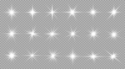 Glowing white stars with shimmering rays and lens flare effects. Great for Christmas designs and magical illustrations. Transparent background format.