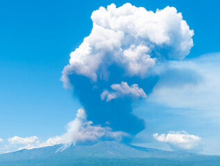 great volcano erupting on blue cloudy sky background. Vulcano Etna during eruprtion with big cloud of vulcanic smoke above the crater.