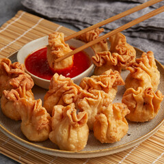 Wontons with cashew and carrot filling