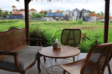 Wooden patio with a round table and two chairs