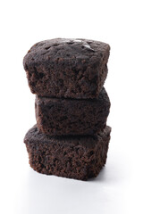 Stack of homemade chocolate brownies isolated on white background