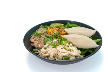 Dry noodles with pure chicken (high protein) and fish balls, brown rice vermicelli, served with boiled long beans and fresh lemon on a white background. Top view.