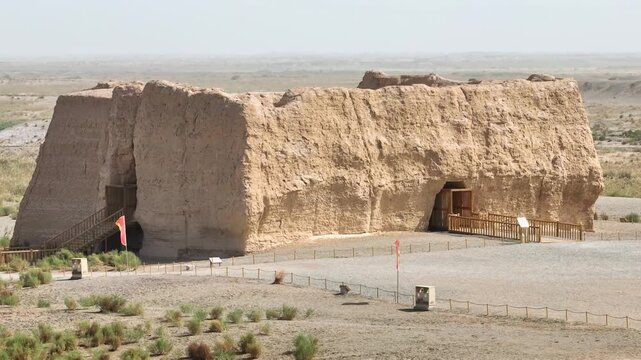Aerial view of the weathered Yumen Pass ruins, standing as a testament to history amidst the arid landscape, Yumen, Gansu, China.