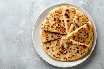 Gzleme flatbread arranged neatly on a plate, showcasing golden-brown crust in a cozy setting