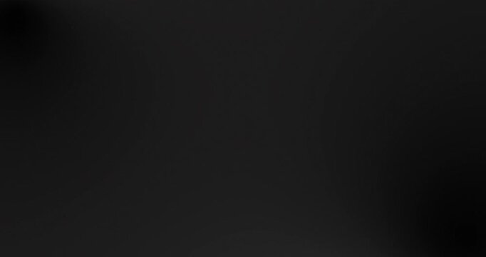 Abstract blurred black Grey gradient 4k background video. Smooth dark tones with subtle fade and soft shadows. Minimal elegant backdrop loop for motion graphics, presentations, and luxury design