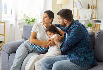 Family parents comfort child in crisis. Mother and father provide steady support and care on the...