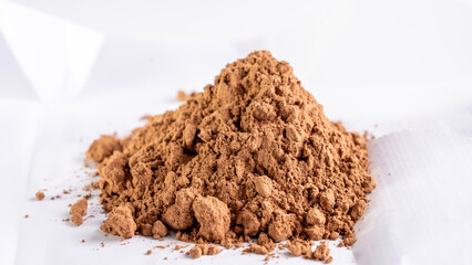 Cocoa powder on a white background. High quality photo