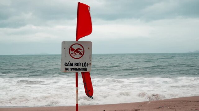 Storm weather, no swimming sign in vietnam 
