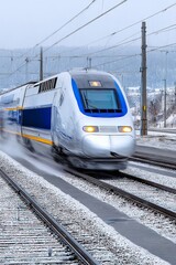 Fototapeta premium High-Speed Train Gliding Through a Winter Landscape, Showcasing Modern Transportation in Motion