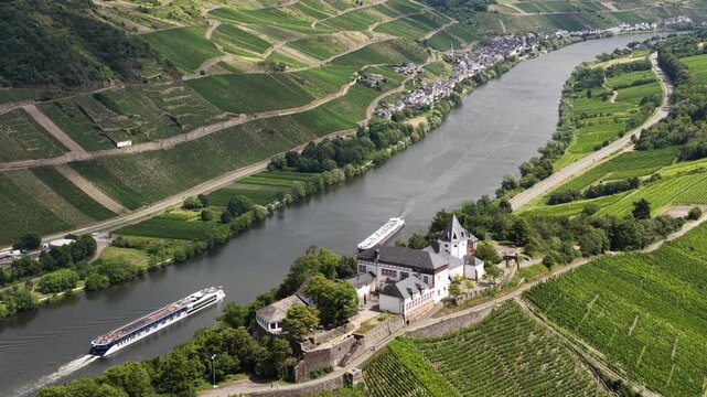 Marienburg, ormer church of medieval origin, partially rebuilt in 1957 with a valley and vineyard. Moselle river and river cruises in the Moselle valleys in summer time.