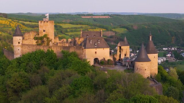 bourscheid castle ch&acirc;teau de green cover hills farms beautiful homes sunny day train leaving town adds detail reveal around pull dynamic circling drone back 