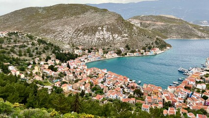 View from above of the town on Kastellorizo (Megisti) Island, Greece. Greek island travel, Mediterranean vacation, scenic landscape, summer tourism, traditional architecture, coastal town.