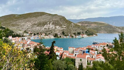 View from above of the town on Kastellorizo (Megisti) Island, Greece. Greek island travel, Mediterranean vacation, scenic landscape, summer tourism, traditional architecture, coastal town. 