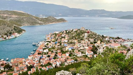 View from above of the town on Kastellorizo (Megisti) Island, Greece. Greek island travel, Mediterranean vacation, scenic landscape, summer tourism, traditional architecture, coastal town. 