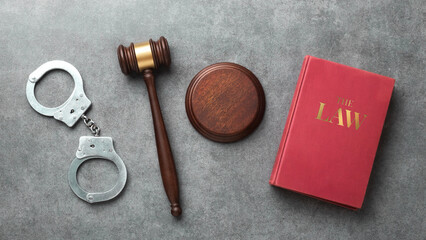 A judge gavel, handcuffs and 