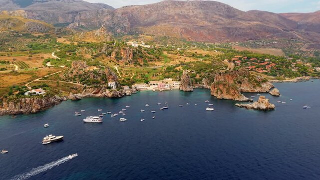 Panorama Of Scopello Coastal Village In Castellammare del Golfo, Trapani Province, Sicily, Southern Italy. Aerial Pullback Shot