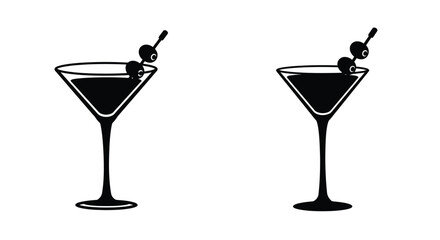 Two black and white martini glasses with olives on cocktail sticks