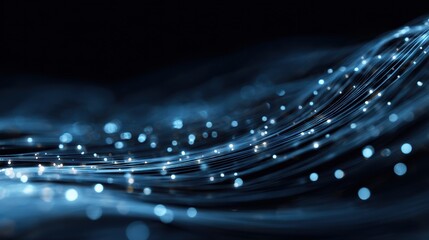 Abstract blue wave background with glowing particles, representing digital technology and innovation aesthetics.