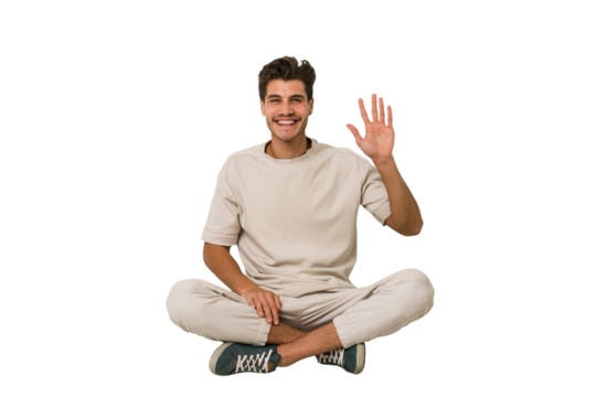 Young caucasian man sitting on the floor isolated on white background smiling cheerful showing number five with fingers.