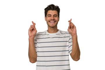 Young handsome caucasian man isolated on white background crossing fingers for having luck