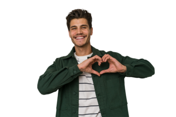 Young handsome caucasian man isolated on white background smiling and showing a heart shape with hands.