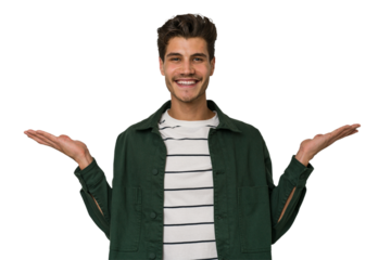 Young handsome caucasian man isolated on white background makes scale with arms, feels happy and confident.
